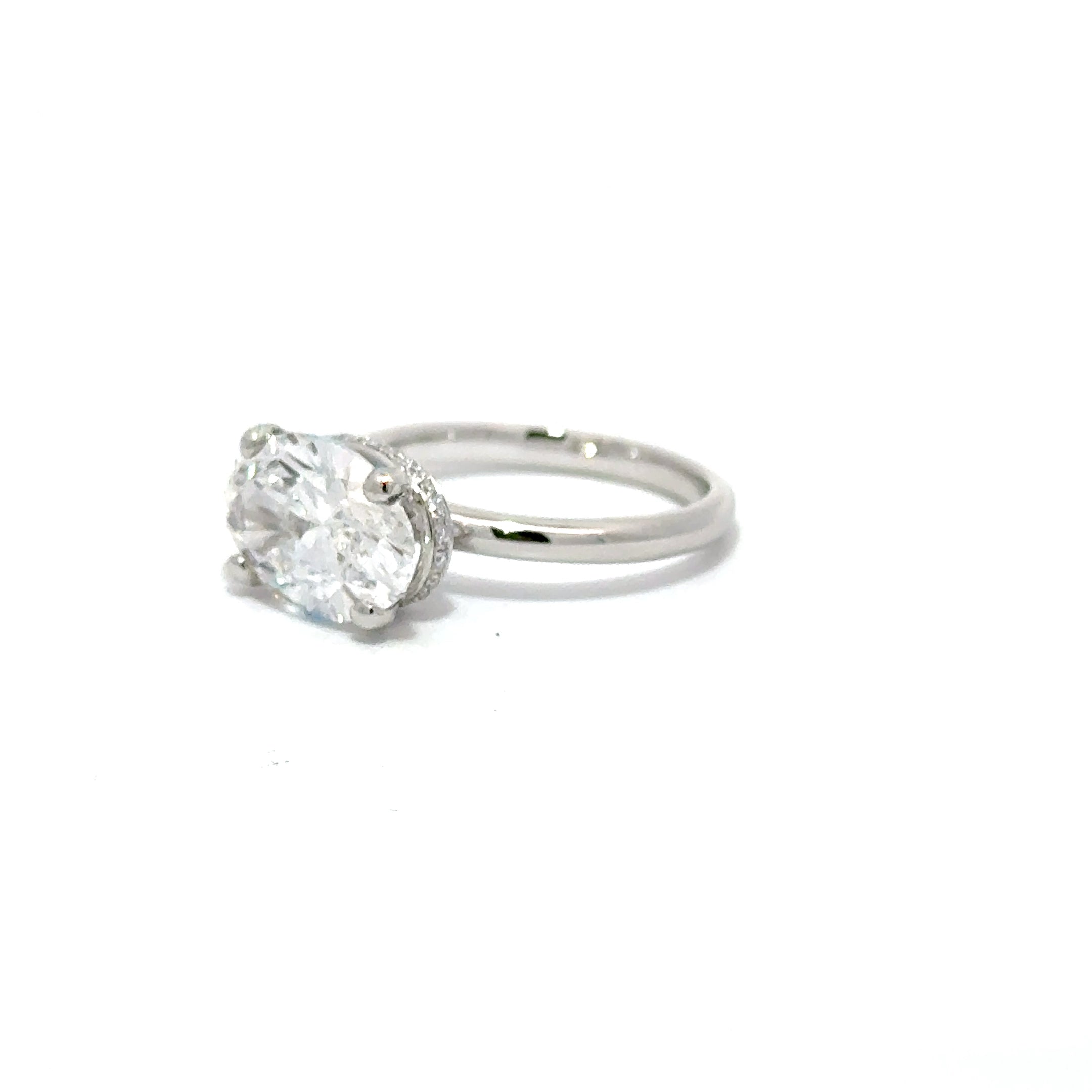 3.59ct Oval Cut Lab Grown Diamond With A Diamond Hidden Halo Set In Platinum 950