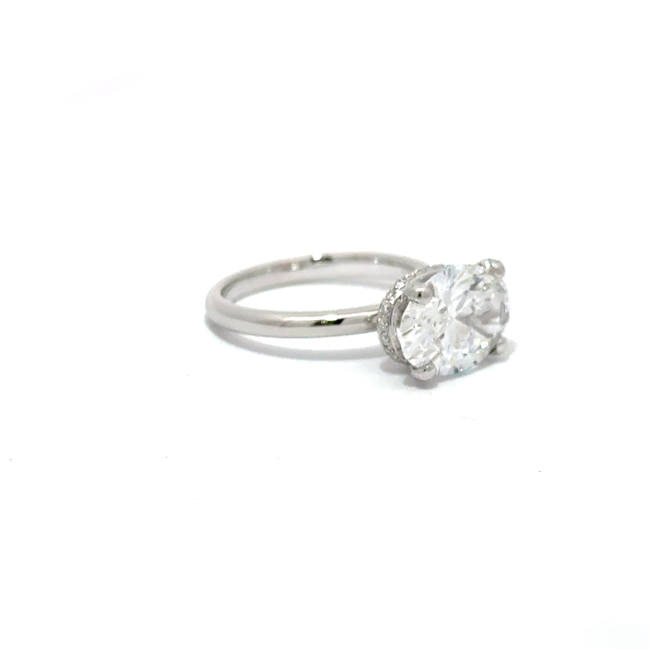 3.59ct Oval Cut Lab Grown Diamond With A Diamond Hidden Halo Set In Platinum 950