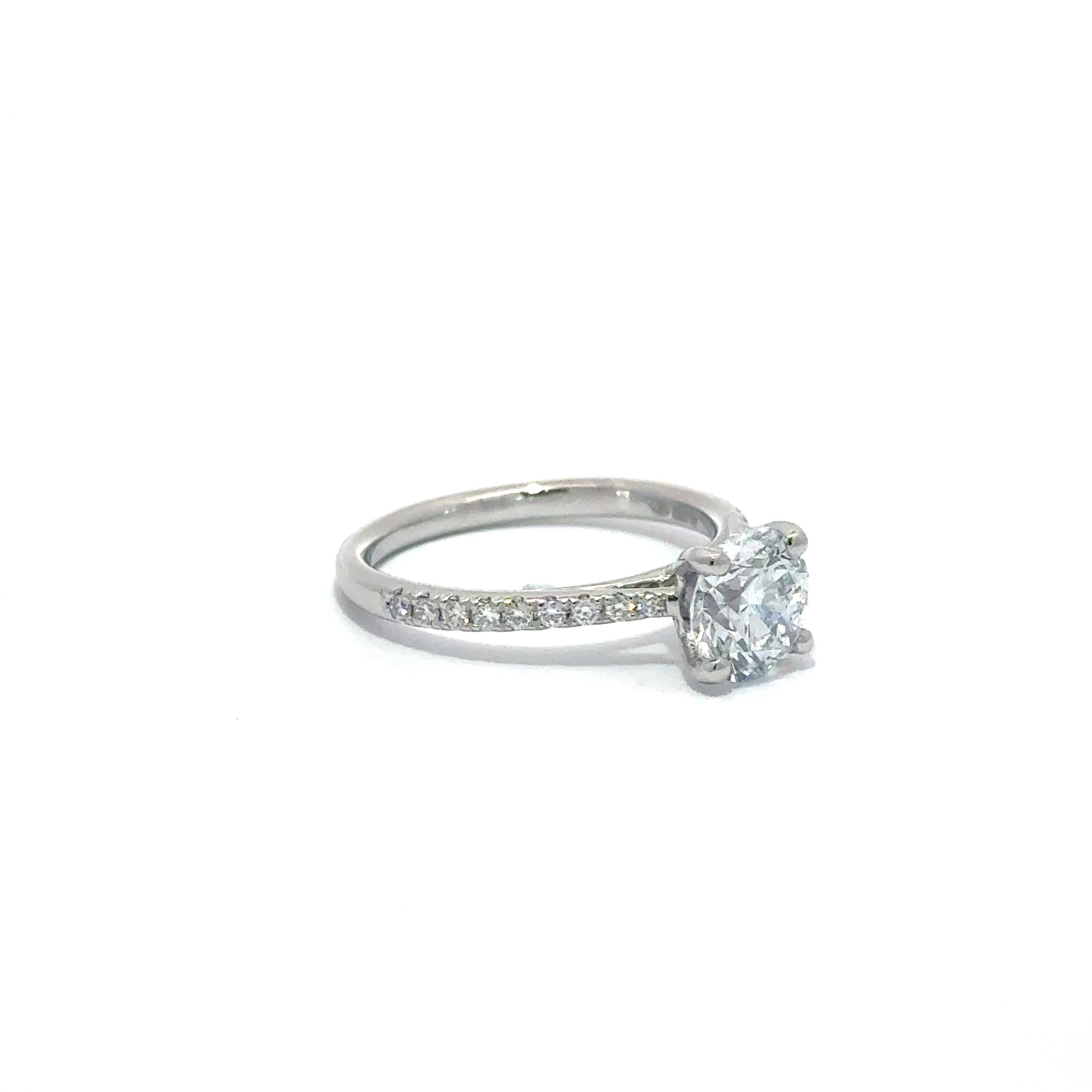 1.52ct Round Brilliant Cut Lab Grown Diamond Ring Set in 18ct White Gold With Diamond Set Shoulders