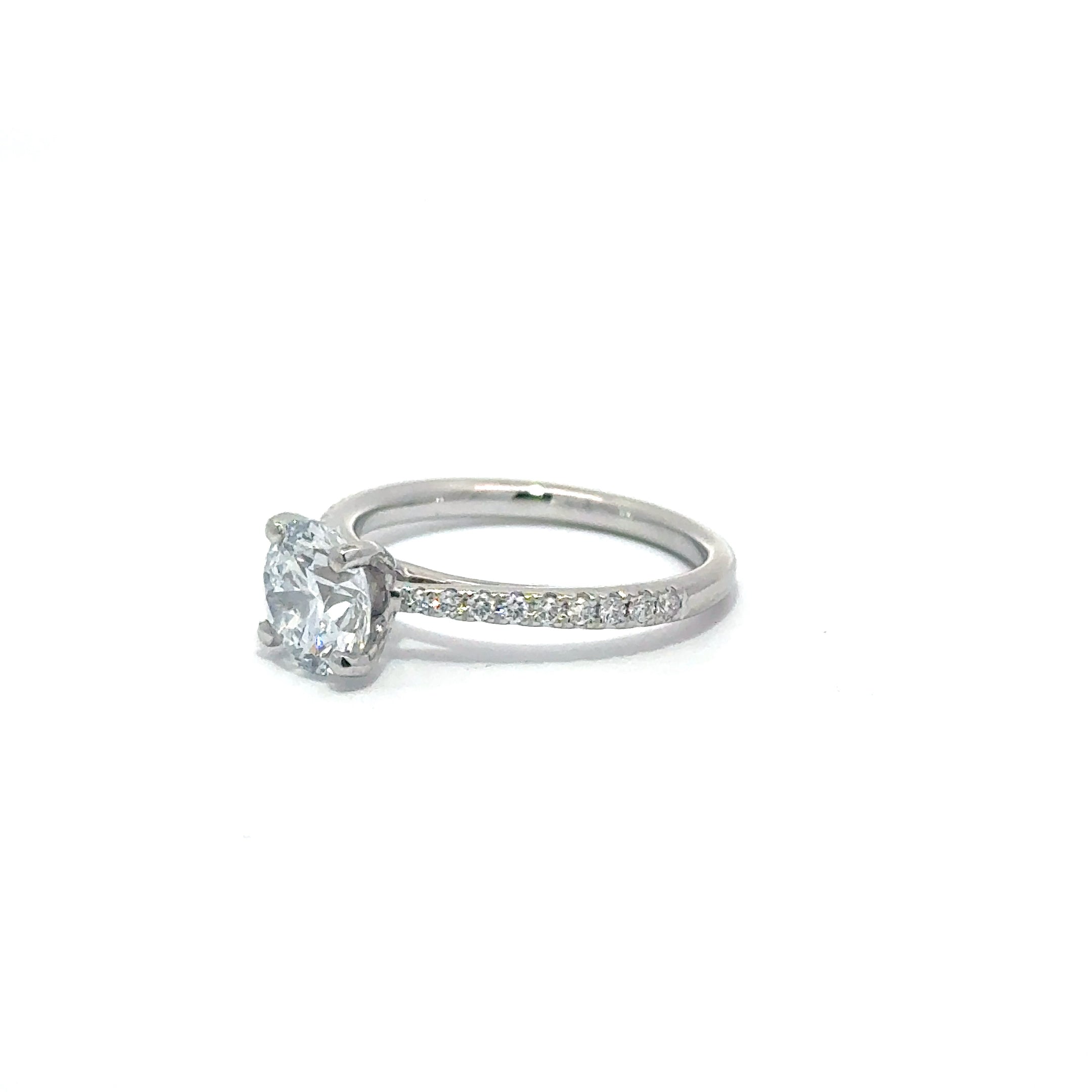 1.52ct Round Brilliant Cut Lab Grown Diamond Ring Set in 18ct White Gold With Diamond Set Shoulders