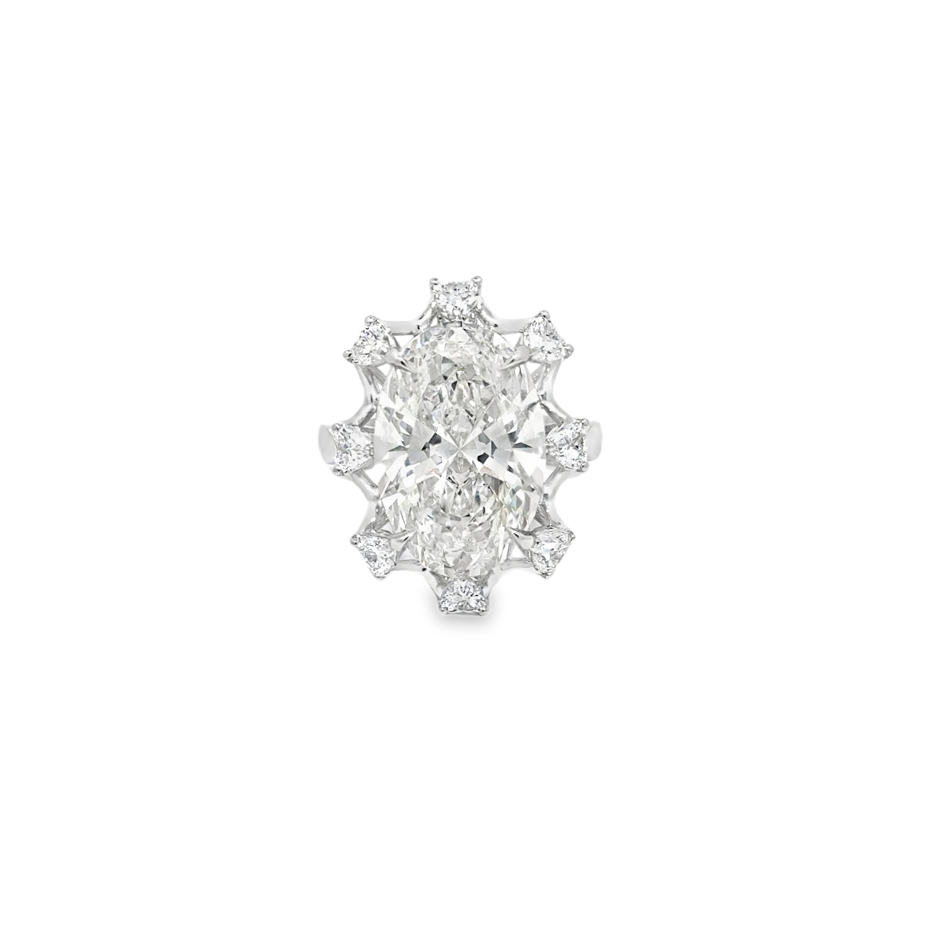 7.14ct Oval Cut Lab Grown Diamond Surrounded By Heart Shape Diamonds Set In Platinum