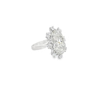 7.14ct Oval Cut Lab Grown Diamond Surrounded By Heart Shape Diamonds Set In Platinum