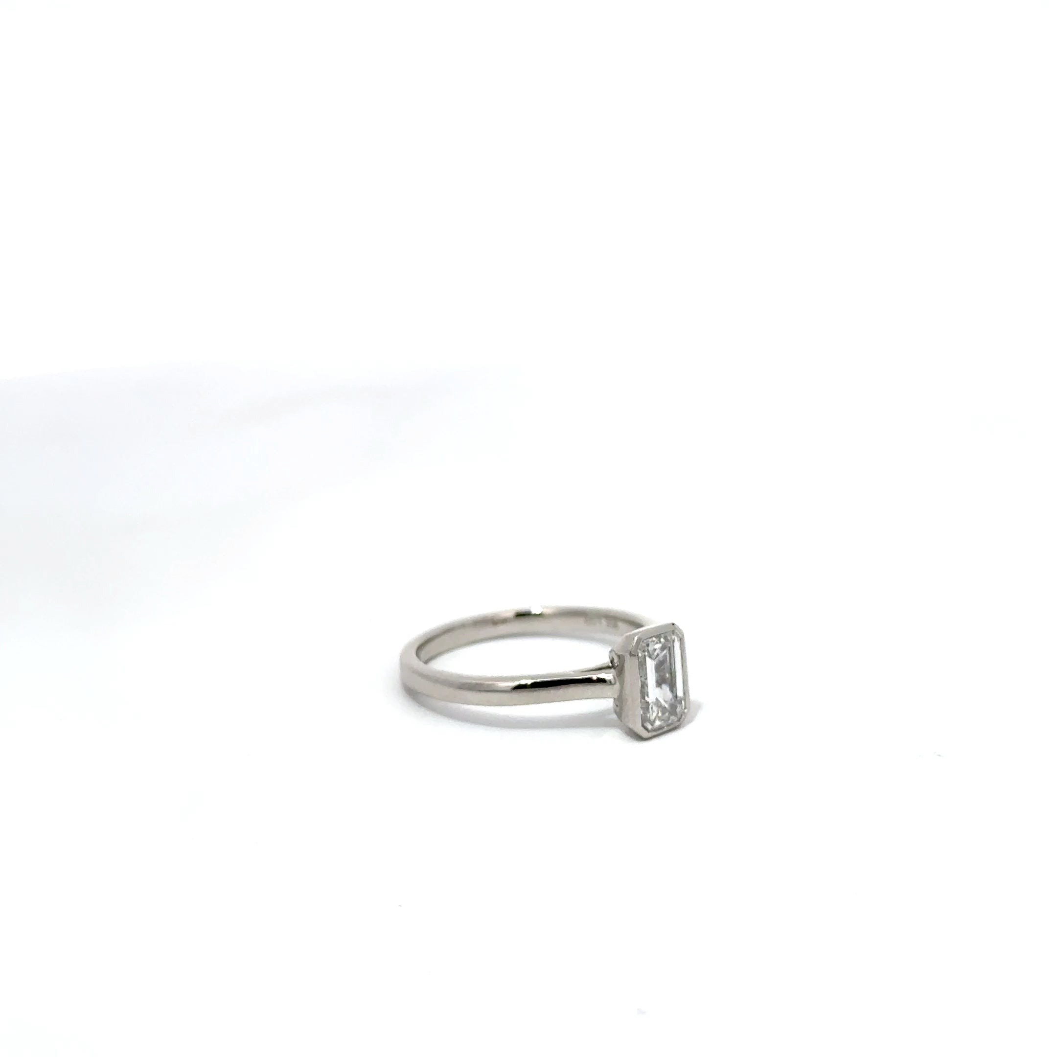 1.01ct Emerald Cut Lab Grown Diamond Bezel Set In Platinum