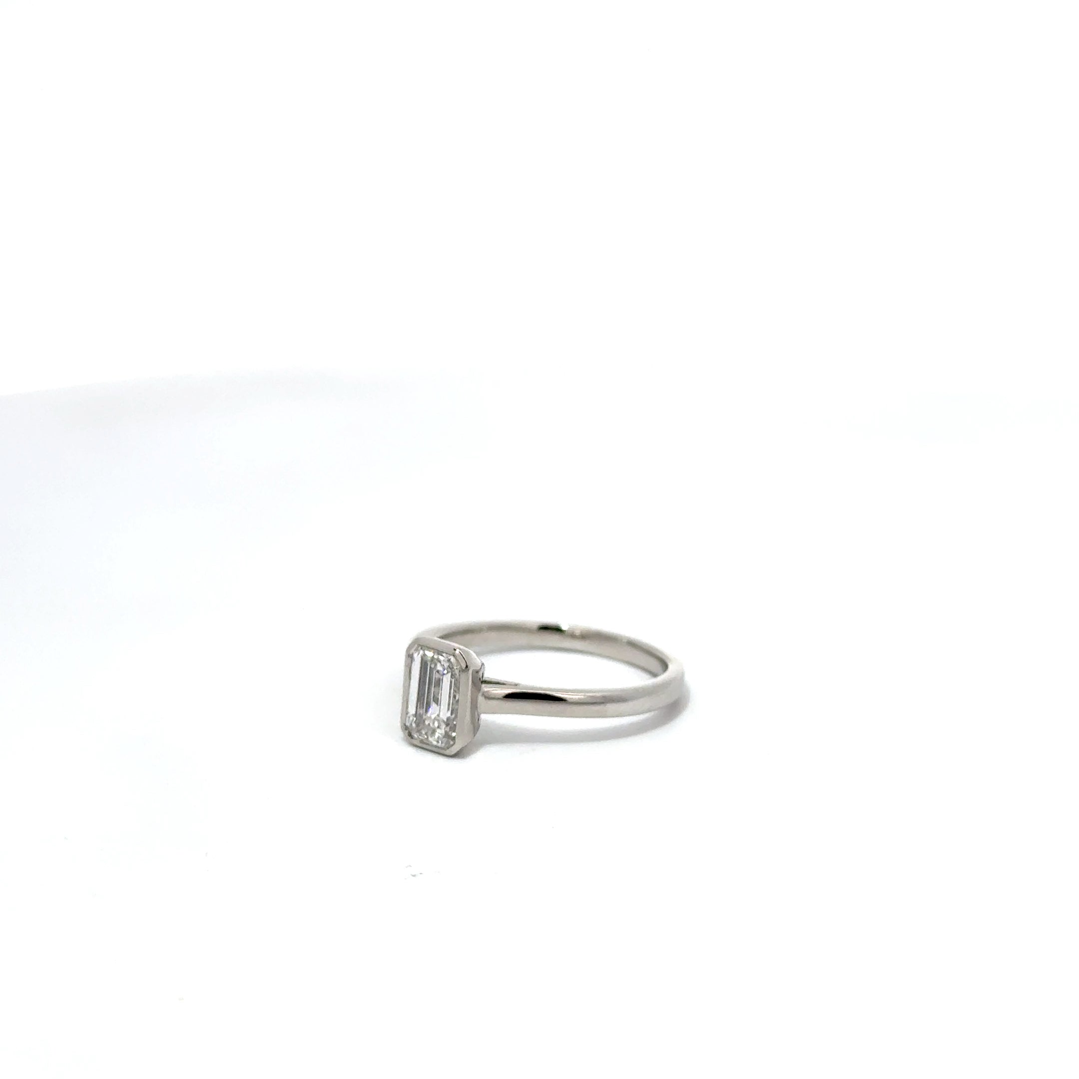 1.01ct Emerald Cut Lab Grown Diamond Bezel Set In Platinum