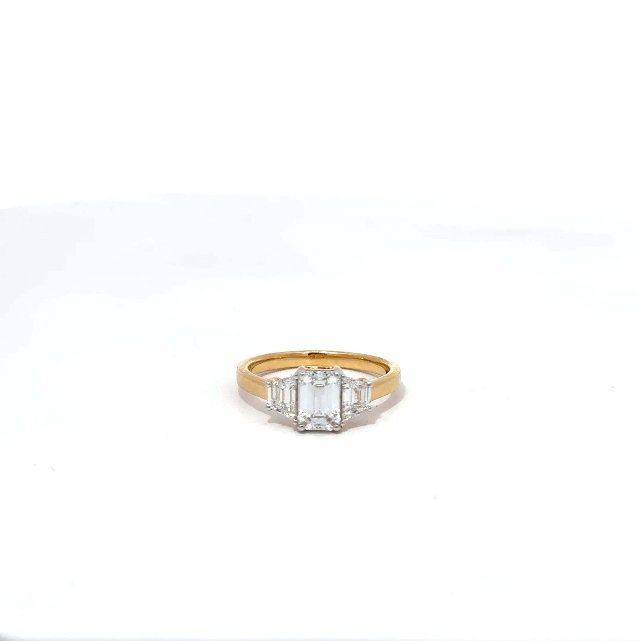 2.12ct Emerald Cut Lab Grown Diamond 3 Stone Ring Set In 18ct Yellow Gold