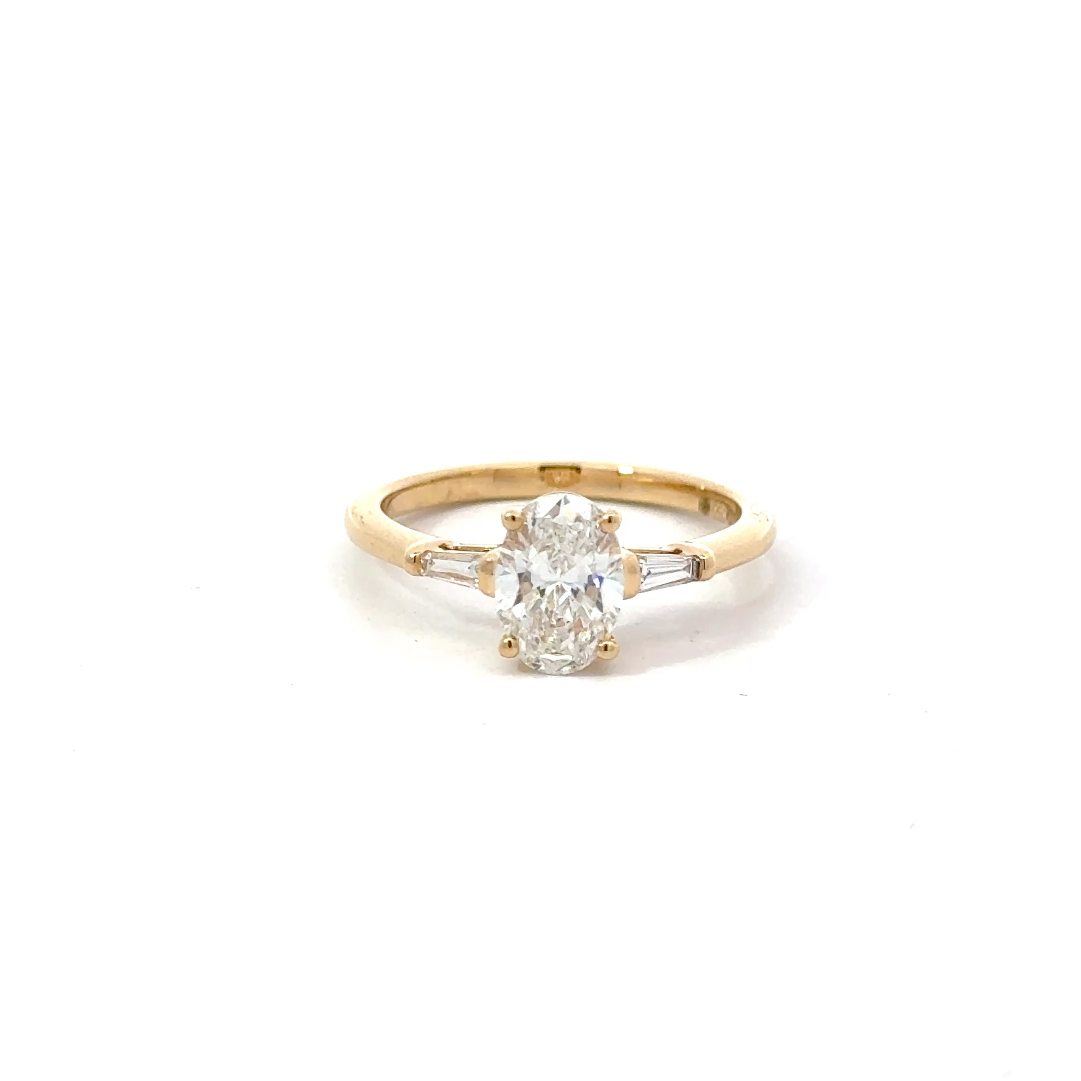 1.11ct Oval Brilliant Cut Lab Grown Diamond 3 Stone With Tapered Baguette Side Stones Set in 18ct Yellow Gold